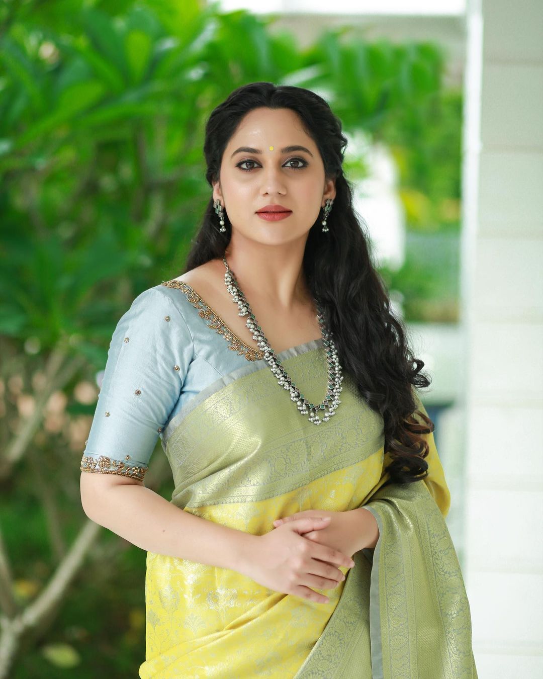 Actress Miya George Beautiful jewelry in Lemon Yellow Saree